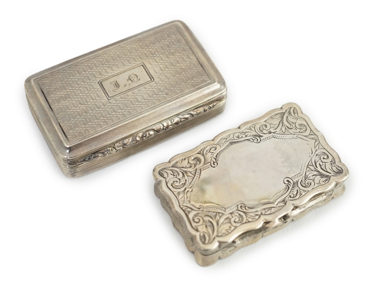 A George IV silver snuff box, with engraved initials, Thomas Shaw?, Birmingham, 1826, 54mm, together with a Victorian silver snuff box, George Unite, Birmingham, 1875.